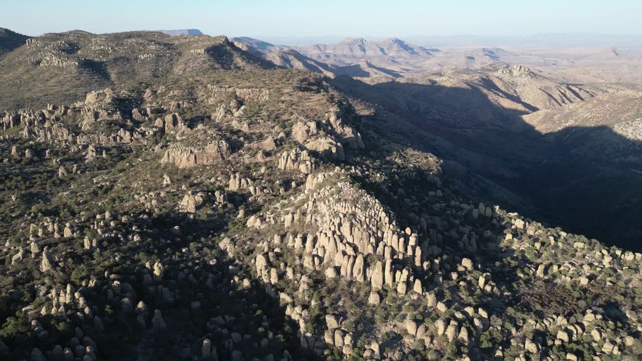 Rocky stone spires in Valle de los Monjes, Creel, surrounded by rugged mountains