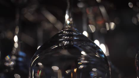 blurred wine glasses in a bar