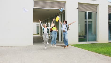 celebrating graduation: students toss papers in the air