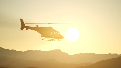 extreme slow motion flying helicopter and sunset sky