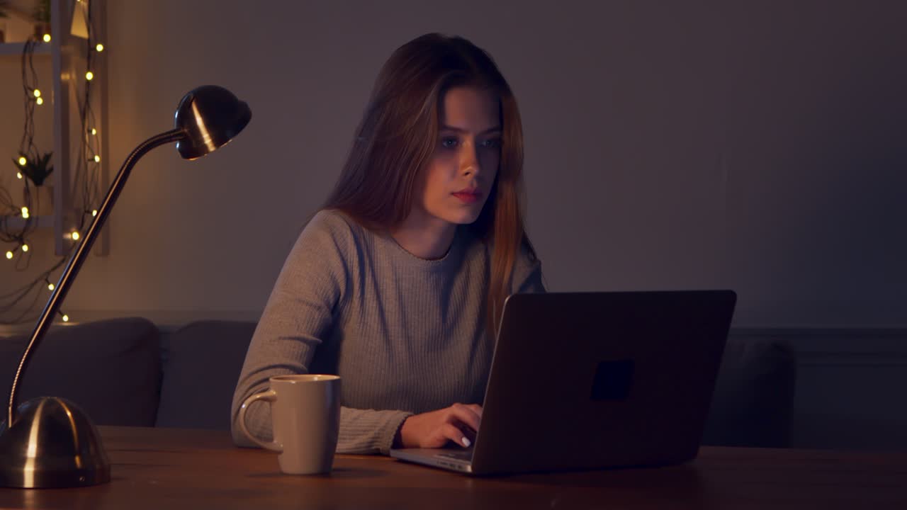 Young Woman Working Late at Night