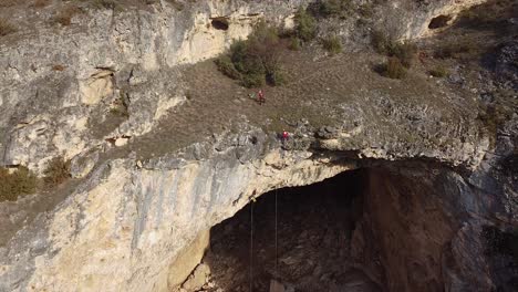 emergency rescue team climbing down an abyss