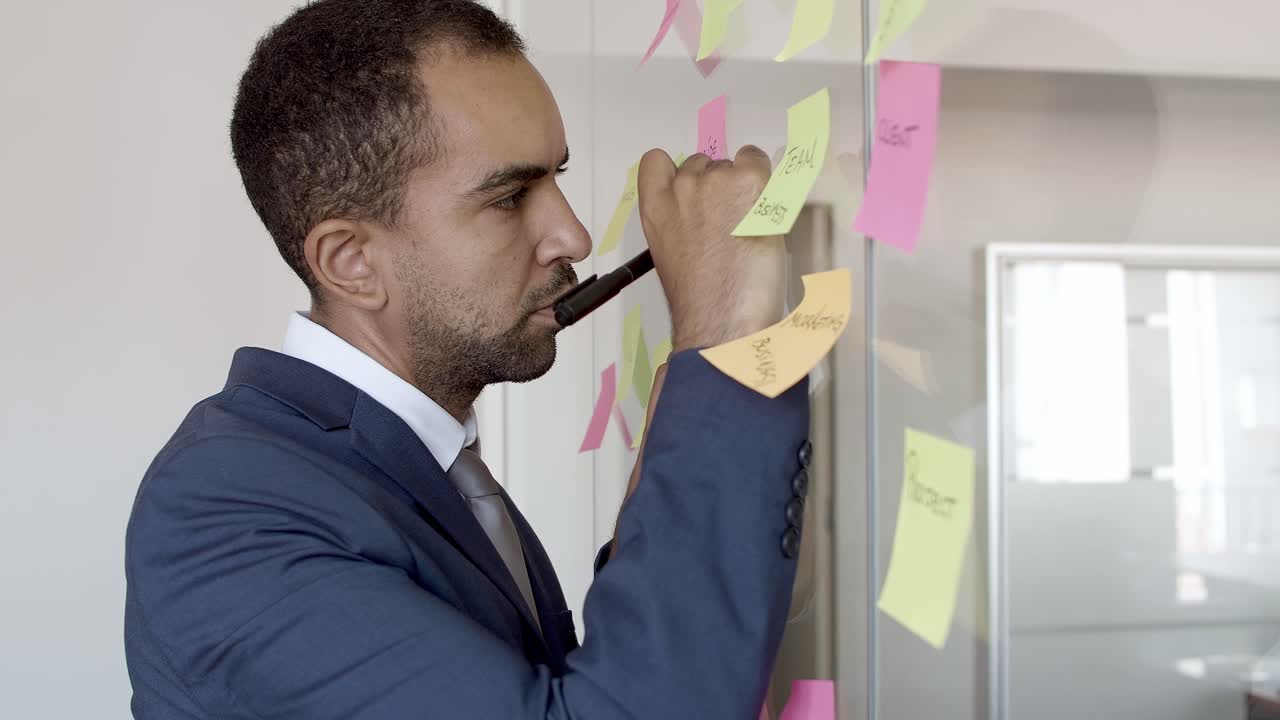 Focused professional wearing suit