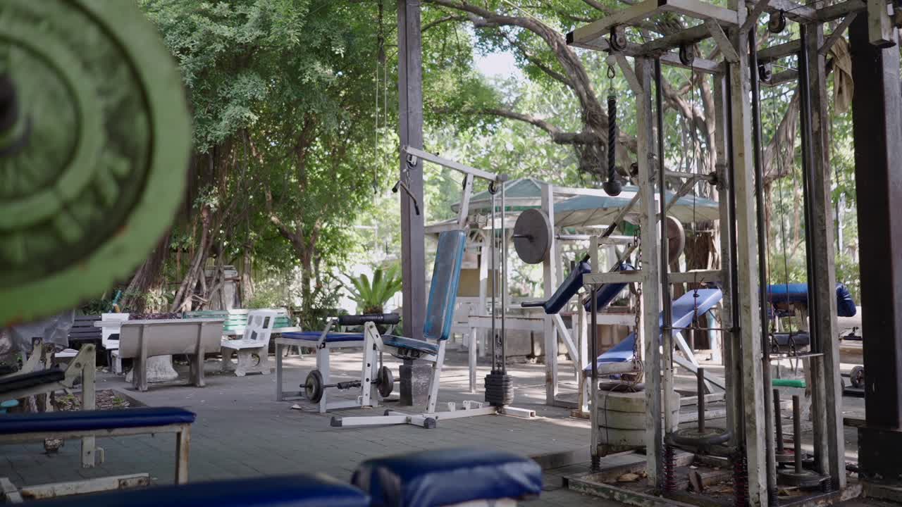 An outdoor gym area with various fitness equipment