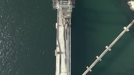 Aerial-Shot-over-the-sea-and-a-crane