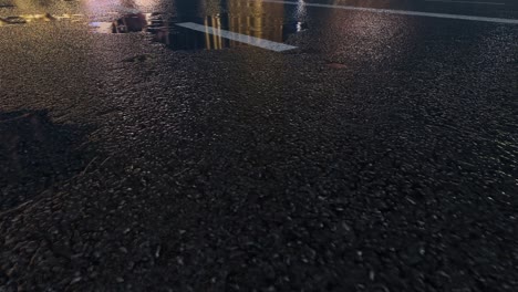 3d heavy rain hitting road at night - 4k realistic rain particle (loopable) - rainy day on a colorful street with traffic - wet road at night - low angle shot of in the rain - rainfall and reflection on road - loopable moving image - cuba - havana