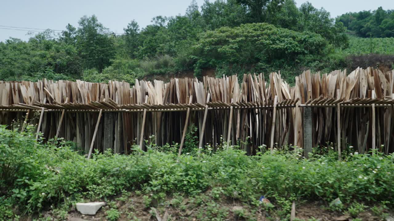 Wooden planks drying in a rural area