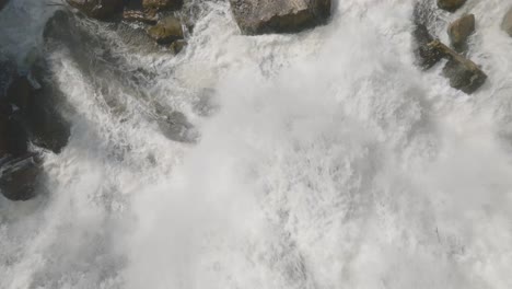 Raging-waterfall-in-Owen-Sound,-Canada,-captured-from-an-aerial-view-on-a-cloudy-day