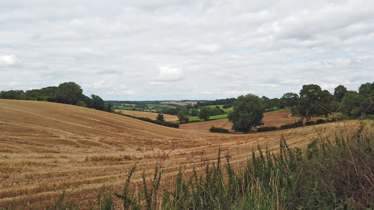 Looking across the beautiful English countryside after the fields have been harvested and the grain has been gathered in
