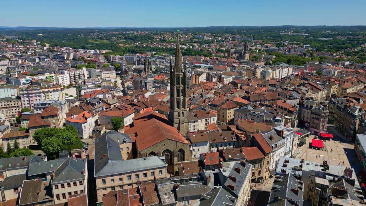 Basilique Saint-Michel-des-Lions and surrounding cityscape, Limoges, France. Aerial drone ascending and cityscape