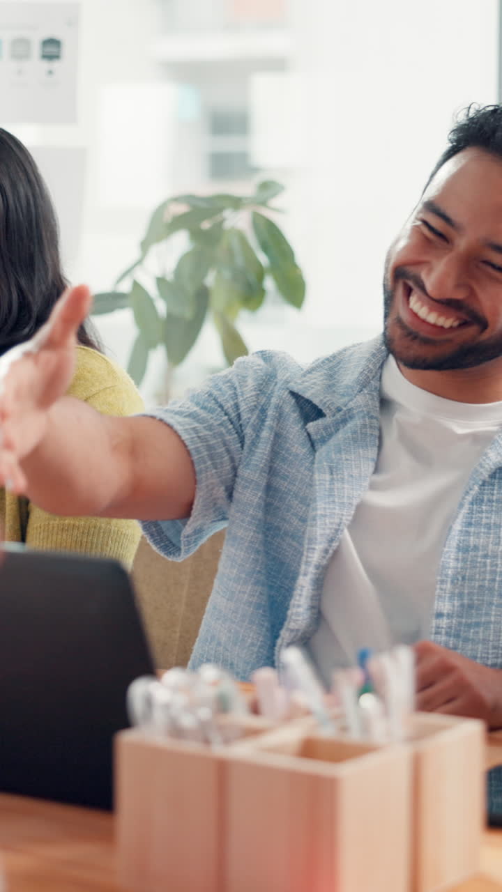 Happy Business Colleagues Shaking Hands and Laughing in Modern Office