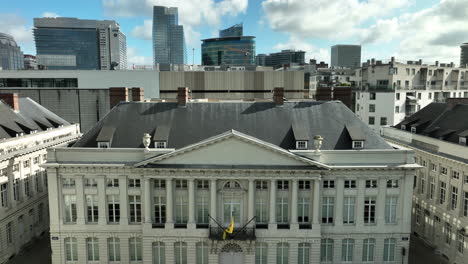 pedestal ascending aerial reveal of brussels city from martyrs' square - place des martyrs