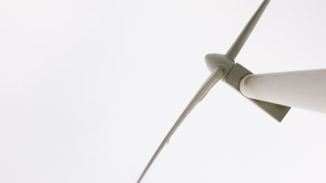 Wind-turbine-spins-against-backdrop-of-sky