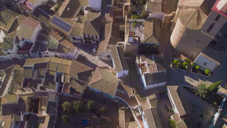 flying over the buildings of iznájar, córdoba, spain