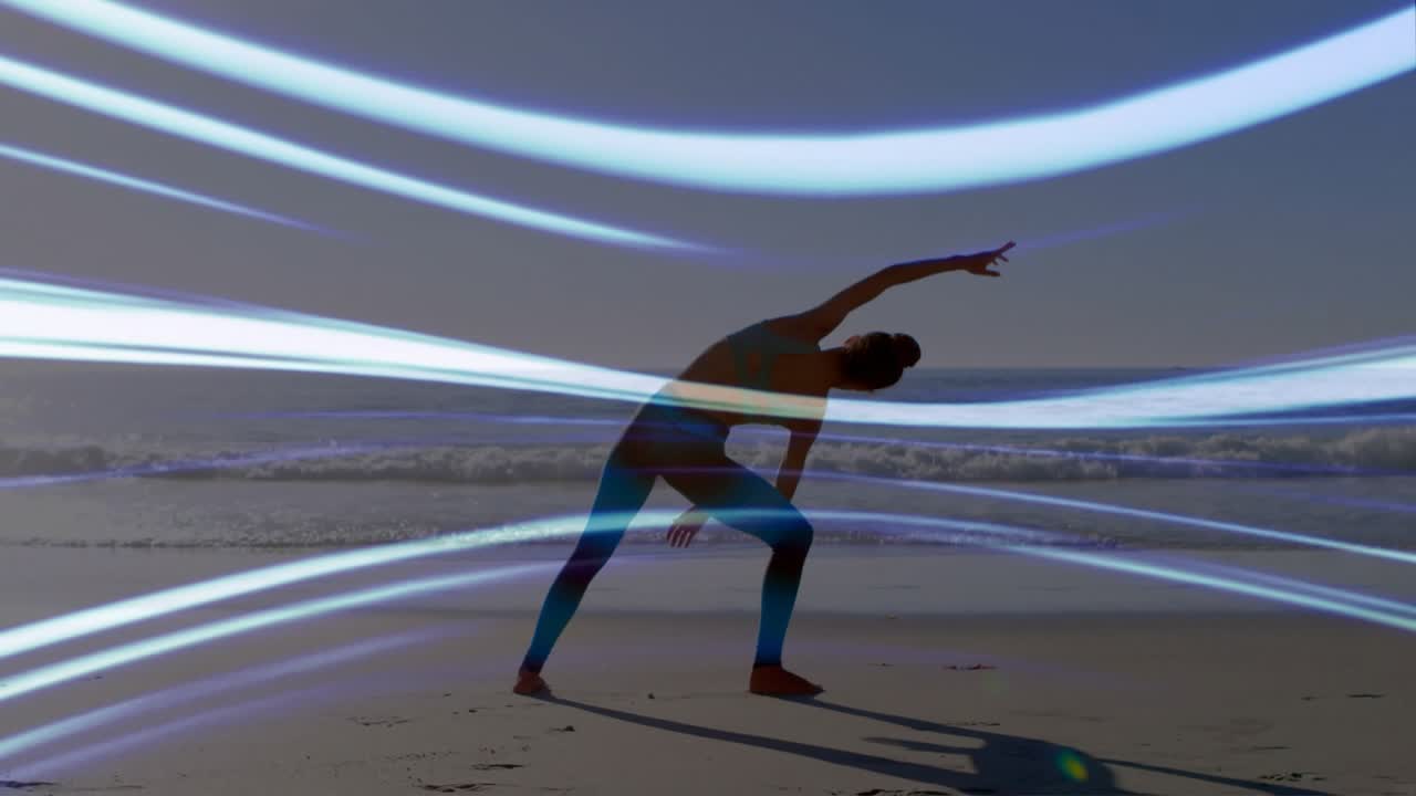 woman holding side angle pose at beach sunrise activating light waves weaving silhouette for health