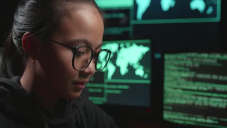 teenage girl concentrating on a coding task