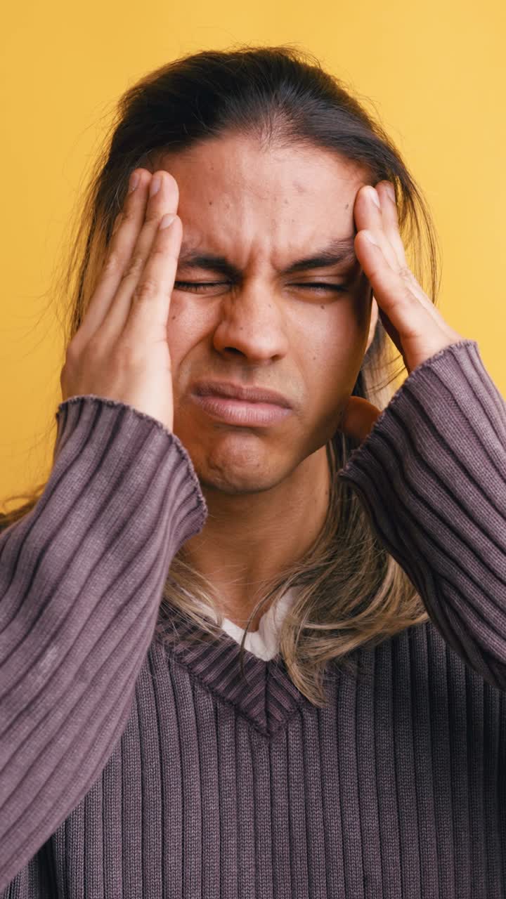 Young Man Suffering from Headache and Stress