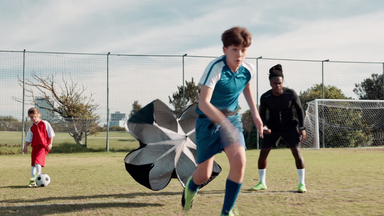 Soccer players training with parachutes