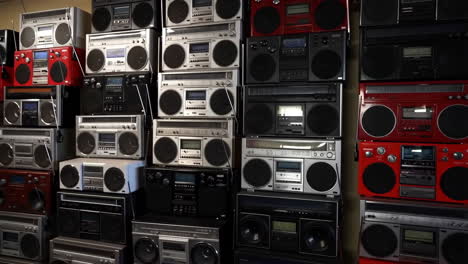 a large collection of vintage boomboxes