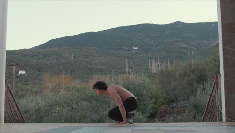 bodyweight fitness handstand to v-sit exercise in beautifully scenic location