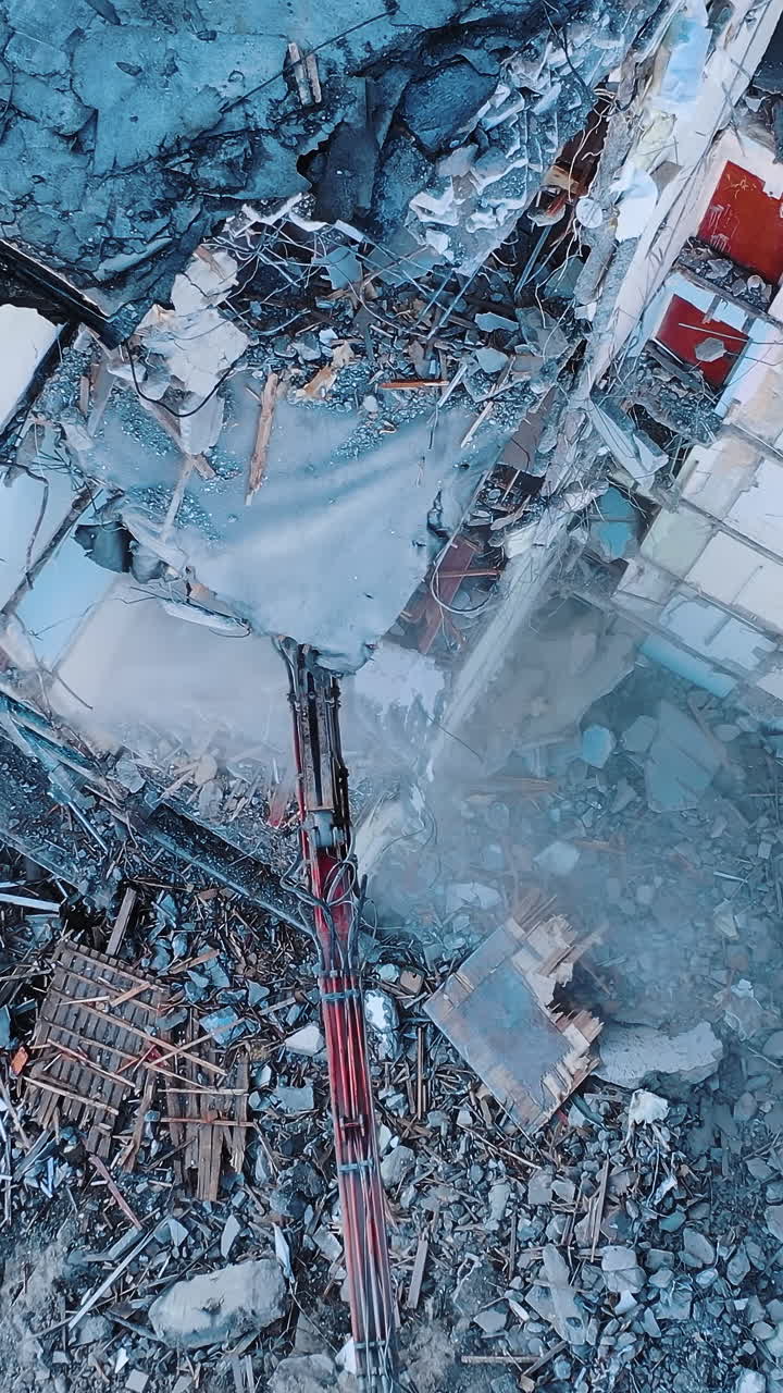 Destructive demolition building by excavator. Construction of destroyed ...