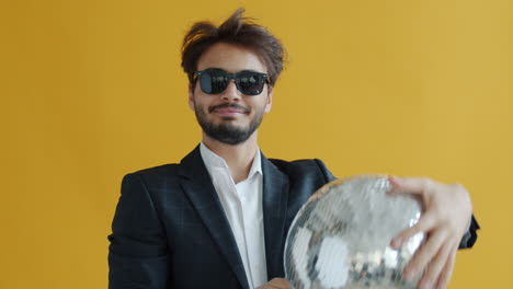 man with disco ball