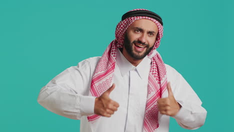 middle eastern guy gives thumbs up