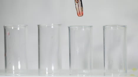 technician drop blood in test tube 3