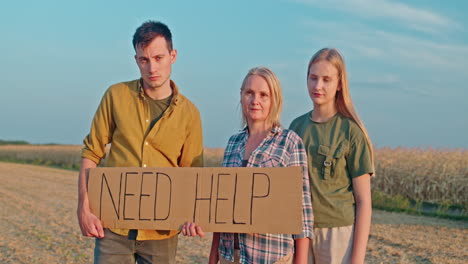 Family Asking for Help in Rural Field