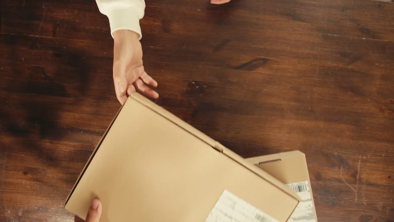 E-commerce storage shop, woman packing goods and clothes for second hand delivery market, dedicated Packaging and Shipping Workspace with Supplies and Technology for efficiency, online sales.