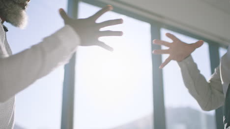 close-up-funny-business-people-fist-bumping-hands-having-fun-casual-meeting-enjoying-playful-success-in-office-4k