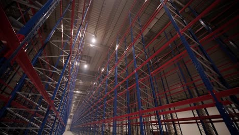 big and modern warehouse under construction, featuring metal shelving and other industrial equipment.