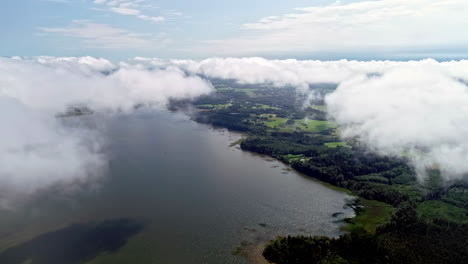 Beautiful-aerial-shot-flying-over-a-European-coast-with-sea-and-cloud