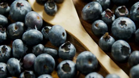 fresh blueberries on wooden table 4k