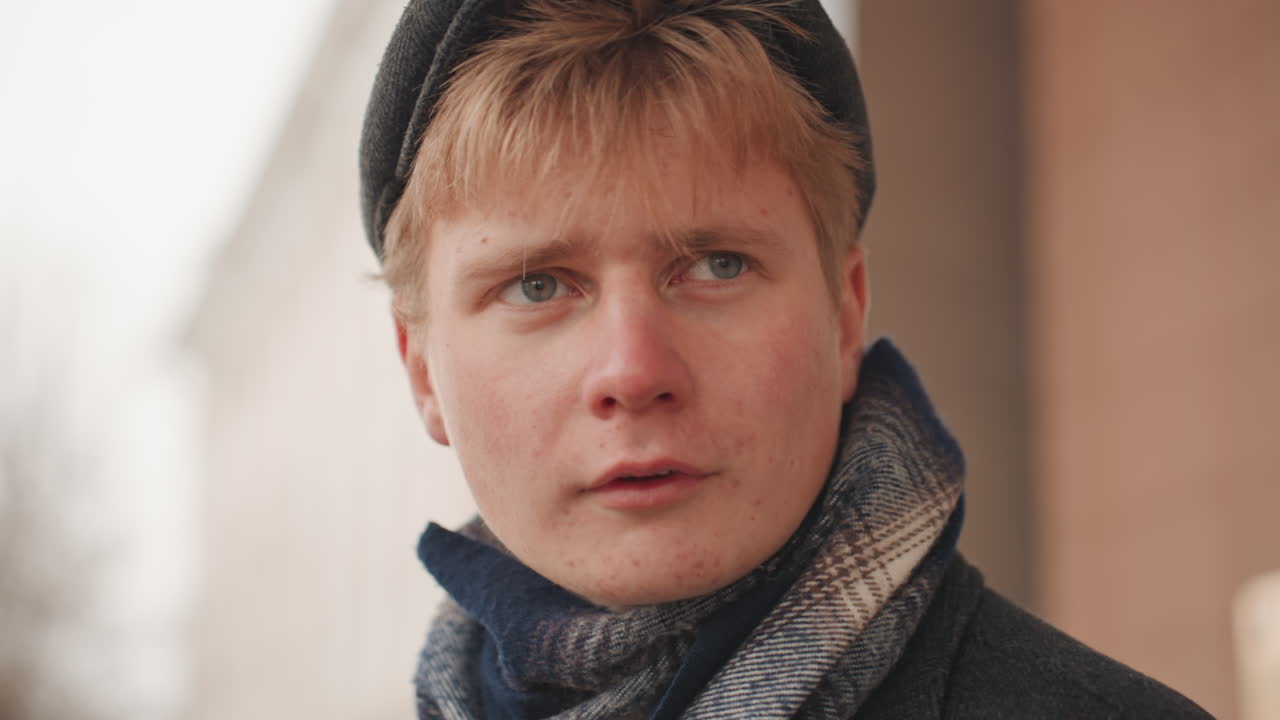 Youthful artist dreaming. Young creator visualizing future ideas. Teenage artist contemplating upcoming creative endeavors. Young white individual pondering new artistic projects in winter