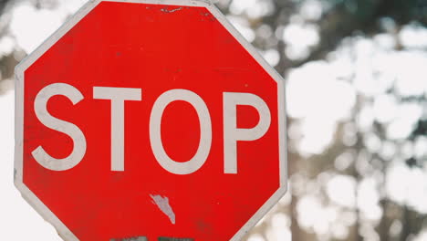 worn stop sign close-up, road signage