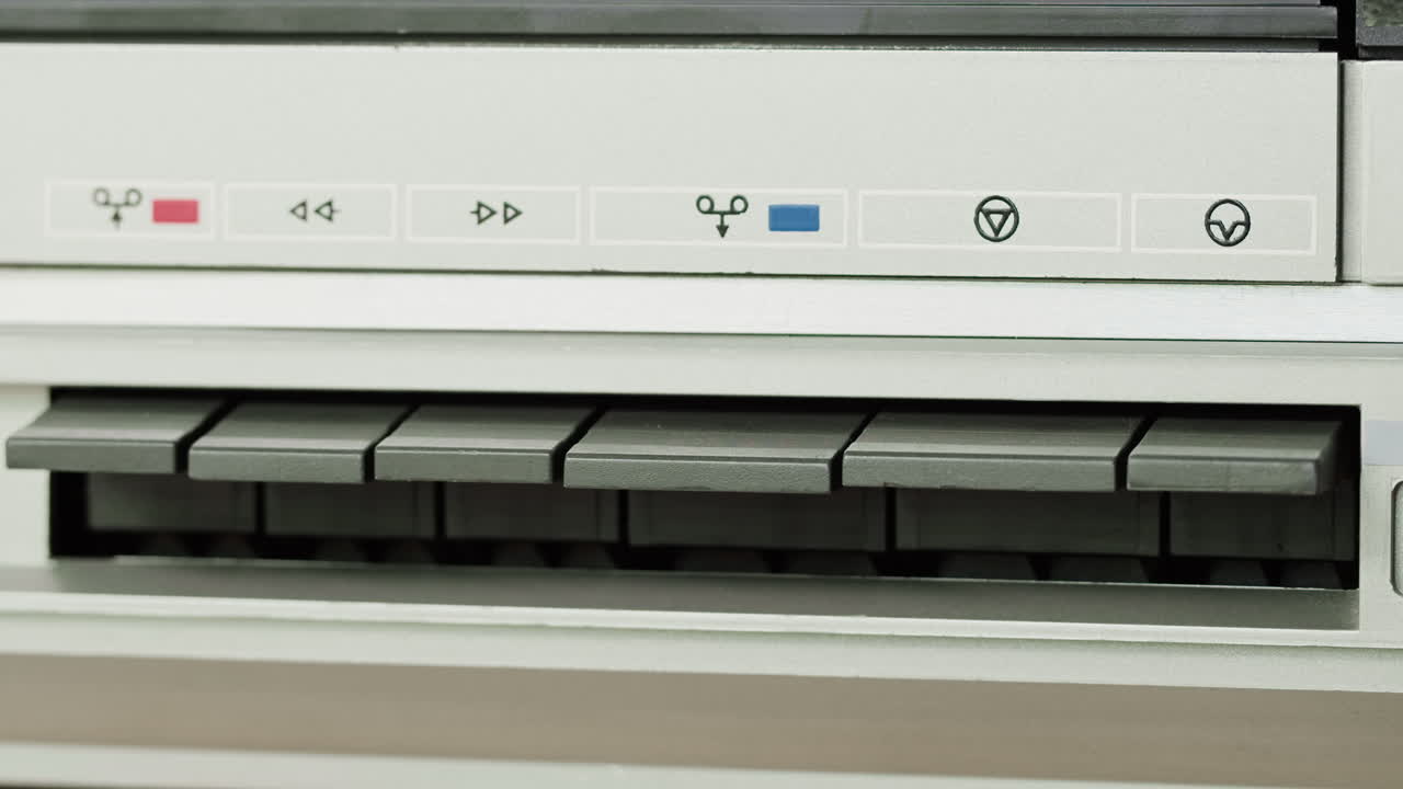 Close-up of a vintage cassette deck control panel