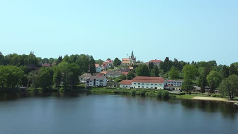 summer vacations camp on the lake magic aerial top view flight vacation paradise village chlum at lake hejtman in czech summer day 2023