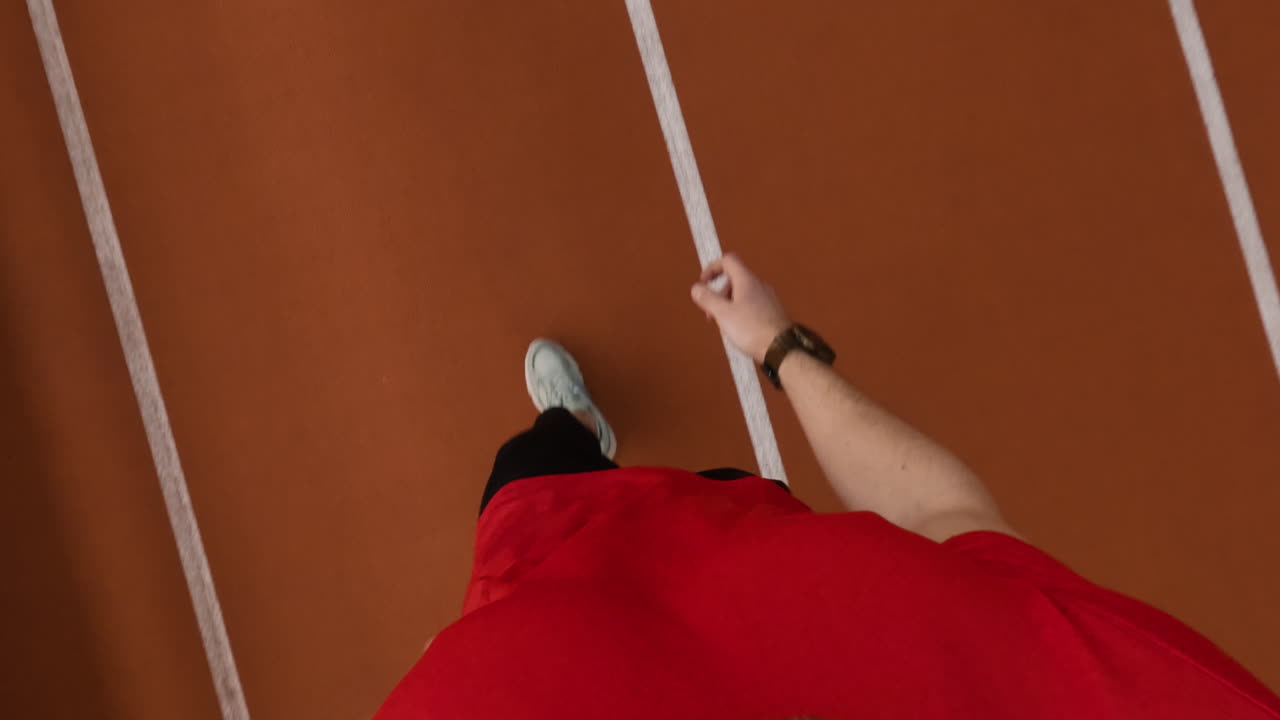 First-person perspective of a person running on a track