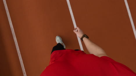 first-person perspective of a person running on a track