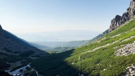 the sun illuminates half a valley in the high tatras, slovakia