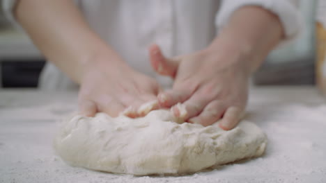 kneading pizza dough by hand