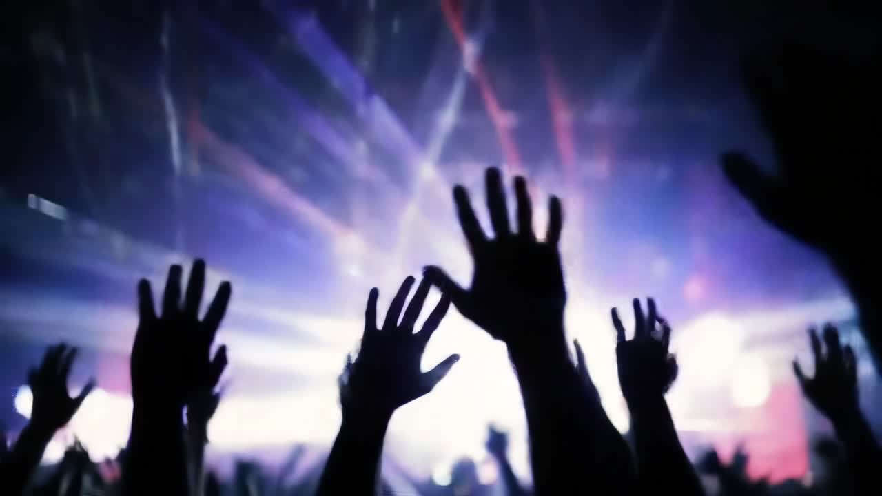 High energy concert moment capturing silhouetted hands waving rhythmically under vibrant stage lighting, embodying pure musical excitement and crowd unity