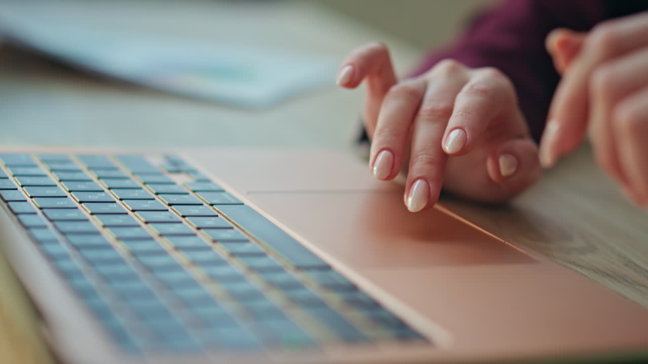 Fingers scrolling laptop touchpad in office closeup. Freelancer browse computer