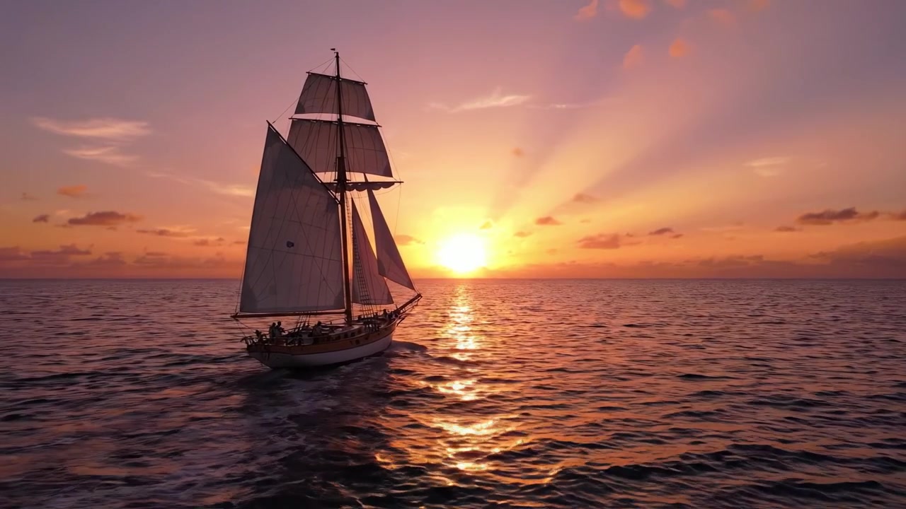 Un maestoso veliero scivola sul mare tranquillo al tramonto, bagnato dal bellissimo bagliore della luce morente, creando una scena marittima mozzafiato