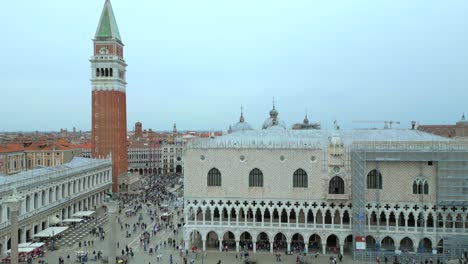 4K-Aerial-of-San-Marco,-the-Rialto-Bridge,-and-the-canals-in-Venice,-Italy-on-a-cloudy-day-9