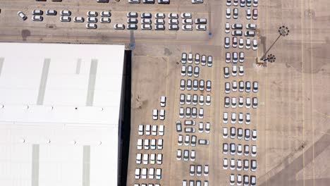 aerial view of a large parking lot with many cars