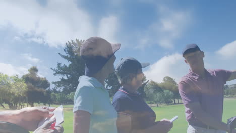 animation of clouds over senior caucasian couple playing golf on golf course