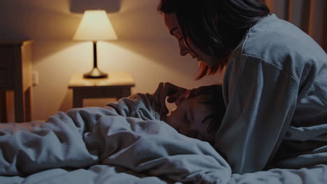 mother comforting child before sleep