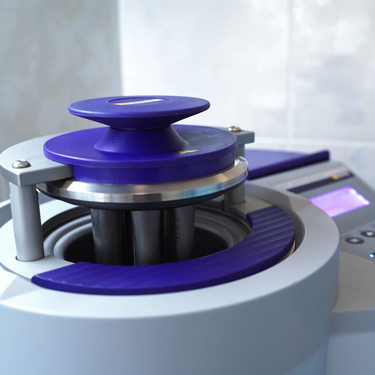 The device lid is going down with the attached dental drilling machine nozzles. Modern advanced equipment at work in dental hospital. Close up